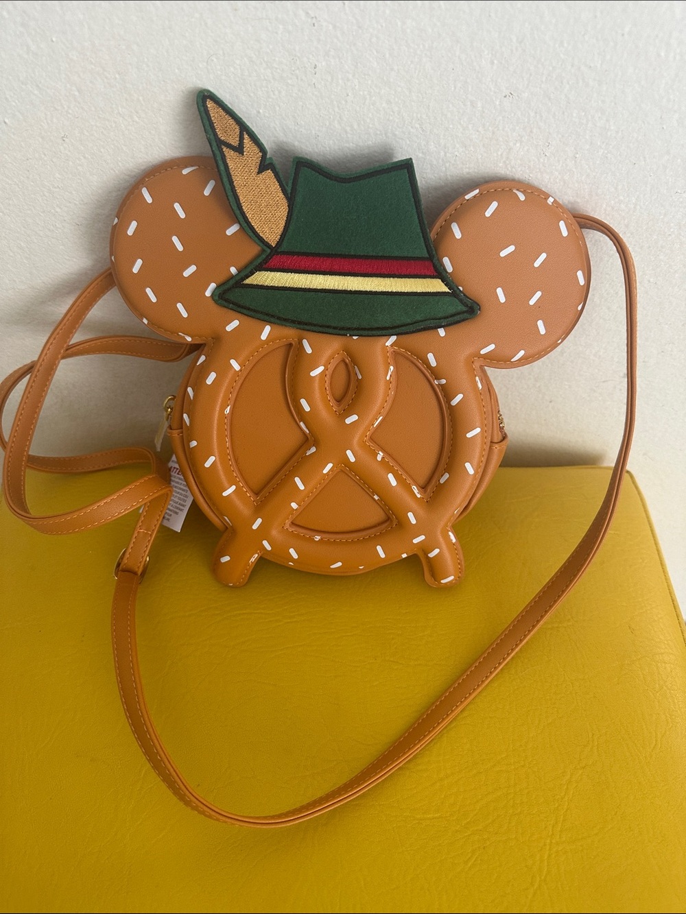 Disney Orange Pretzel-Shaped  Crossbody Bag with Green Hat Accent
